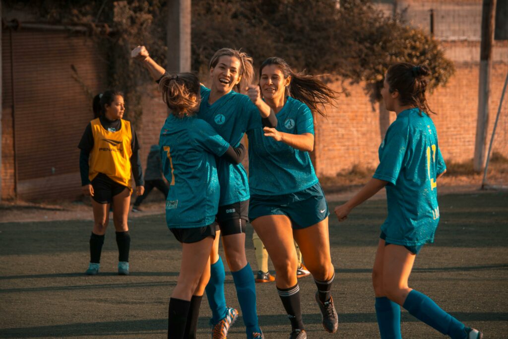 pexels-photo-1198174-1198174 Women's soccer team celebrates a win during a game in Córdoba, Argentina.