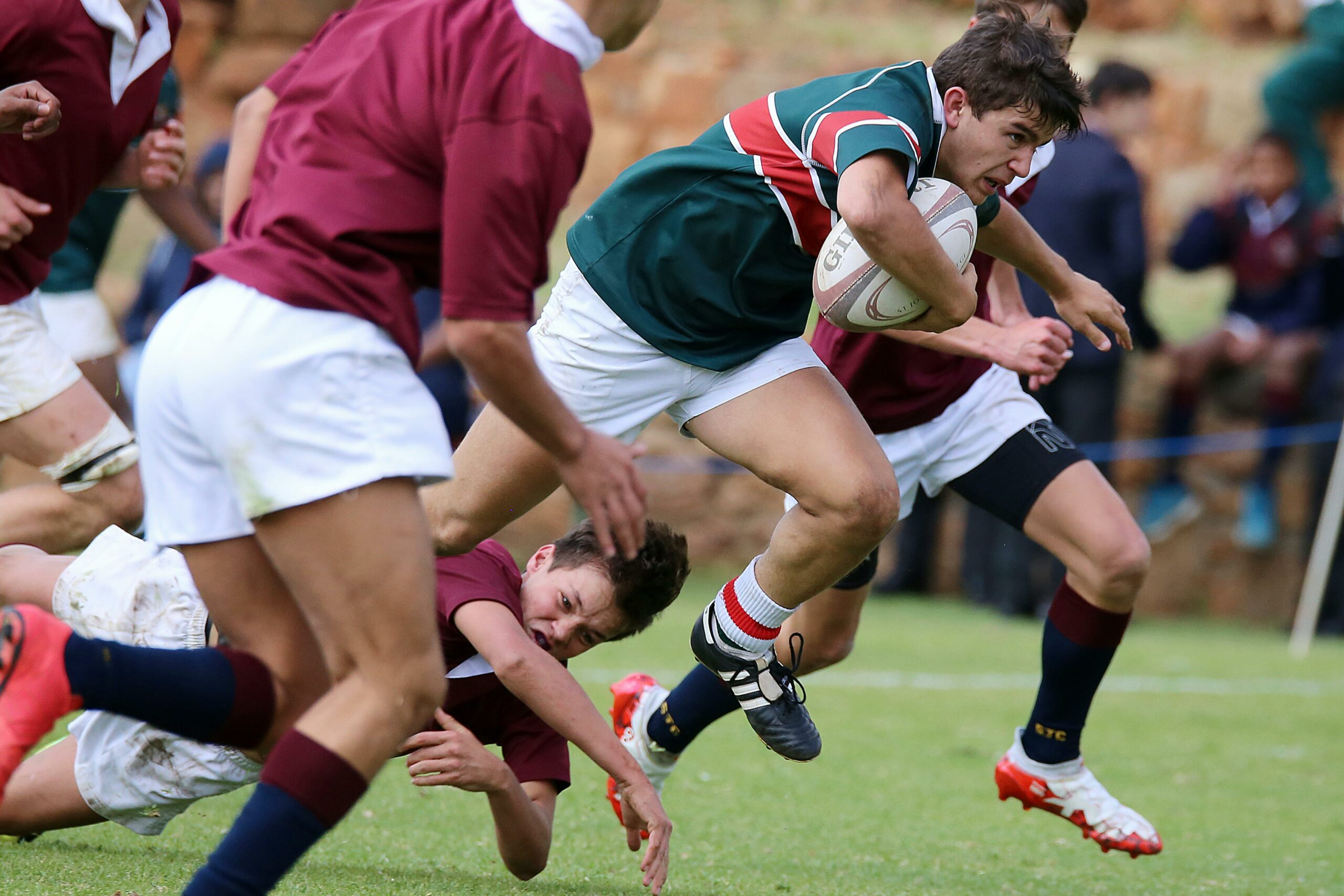 Intense rugby match with players in action, showcasing strength and teamwork.